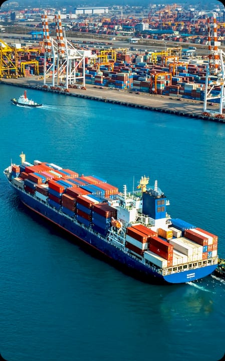 Cargo ship at harbor loaded with shipping containers — ForwarderOne FBA freight forwarding